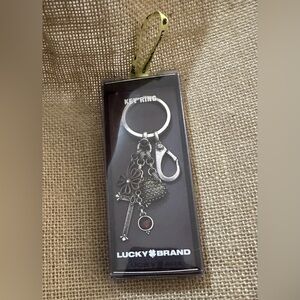 Lucky Brand Silver Key Ring with Peace and Love Inscription